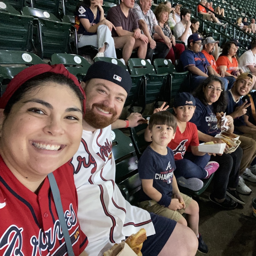 Braves jerseys on the whole row at an Atlanta Braves game
