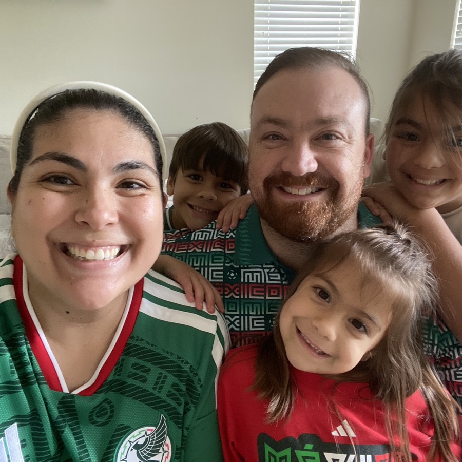 Family couch selfie in México jerseys on game day