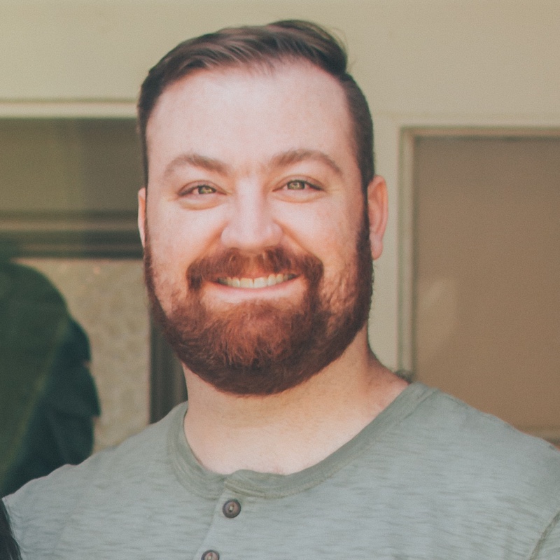 Daniel Glaze, smiling on his front porch